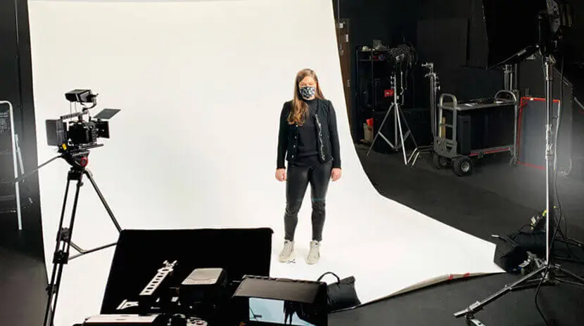 Behind the scenes at a video production studio with female talent.