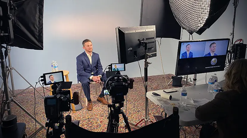 Male lawyer gives an interview inside a production studio.