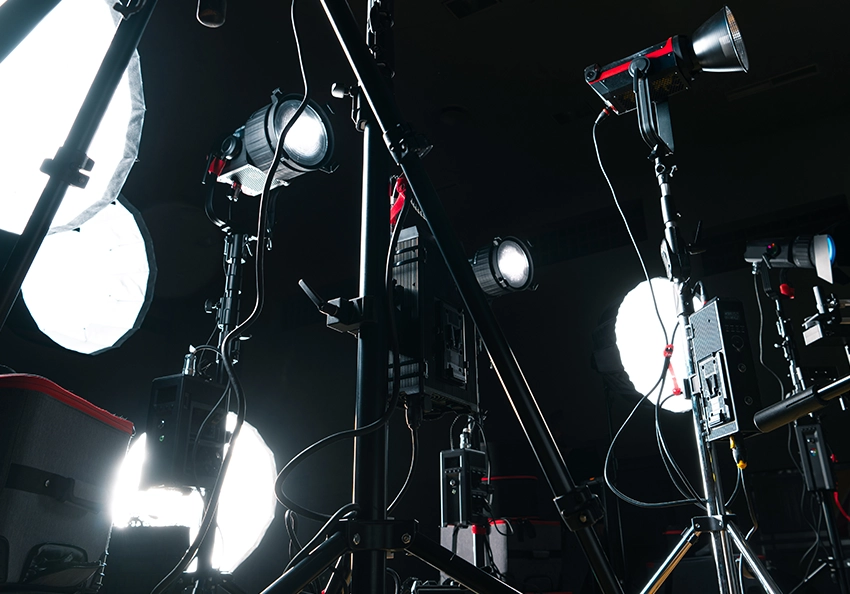 A close-up of cinema gear laid out for a video production kit.